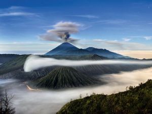 NGC Beautiful Indonesia - Mount Semeru and Bromo "Some Indonesians believe that belching volcanoes such as Mount Semeru (in background) and Mount Bromo (in foreground) are portals to a subterranean world that has shaped not only Indonesia’s landscape but also its beliefs and culture. A long exposure time captured stars in this photo—and the brief balanced light from both a fading moon and a brightening eastern sky".
